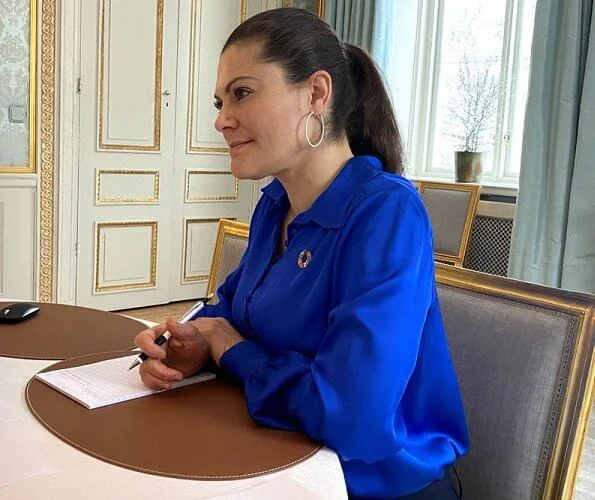 Crown Princess Victoria wore a damen jacket from Houdini, royal blue silk shirt from by Malina, HM, and gold diamonds earrings from LWL Jewelry