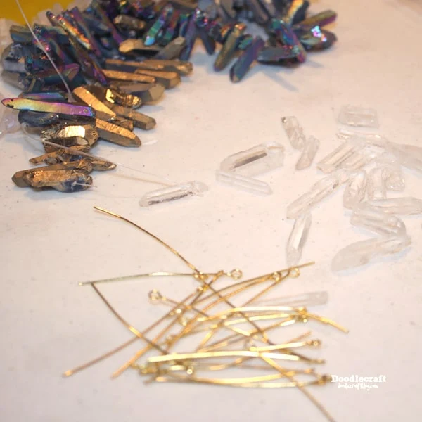 Step 1: Natural Crystal Points   Begin by cutting the line that the beads are strung on. Sift and sort the beads, some will not hang right on a necklace. Find 3 to 5 crystal points that you love.   Enjoy the freedom of mixing colors, shapes and sizes! Make a necklace with as many crystal points as you want...but I'd keep it an odd number.   **FUN TIP** Make mom the perfect necklace for Mother's day and add a crystal representing each child she has!