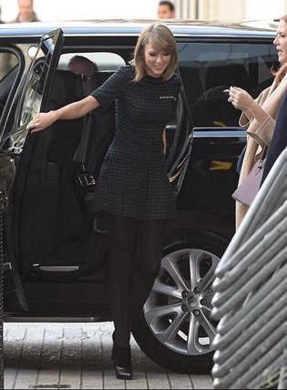 Taylor Swift Exiting Car with Smile