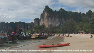 Longtail boats and kayak on beach Railay West