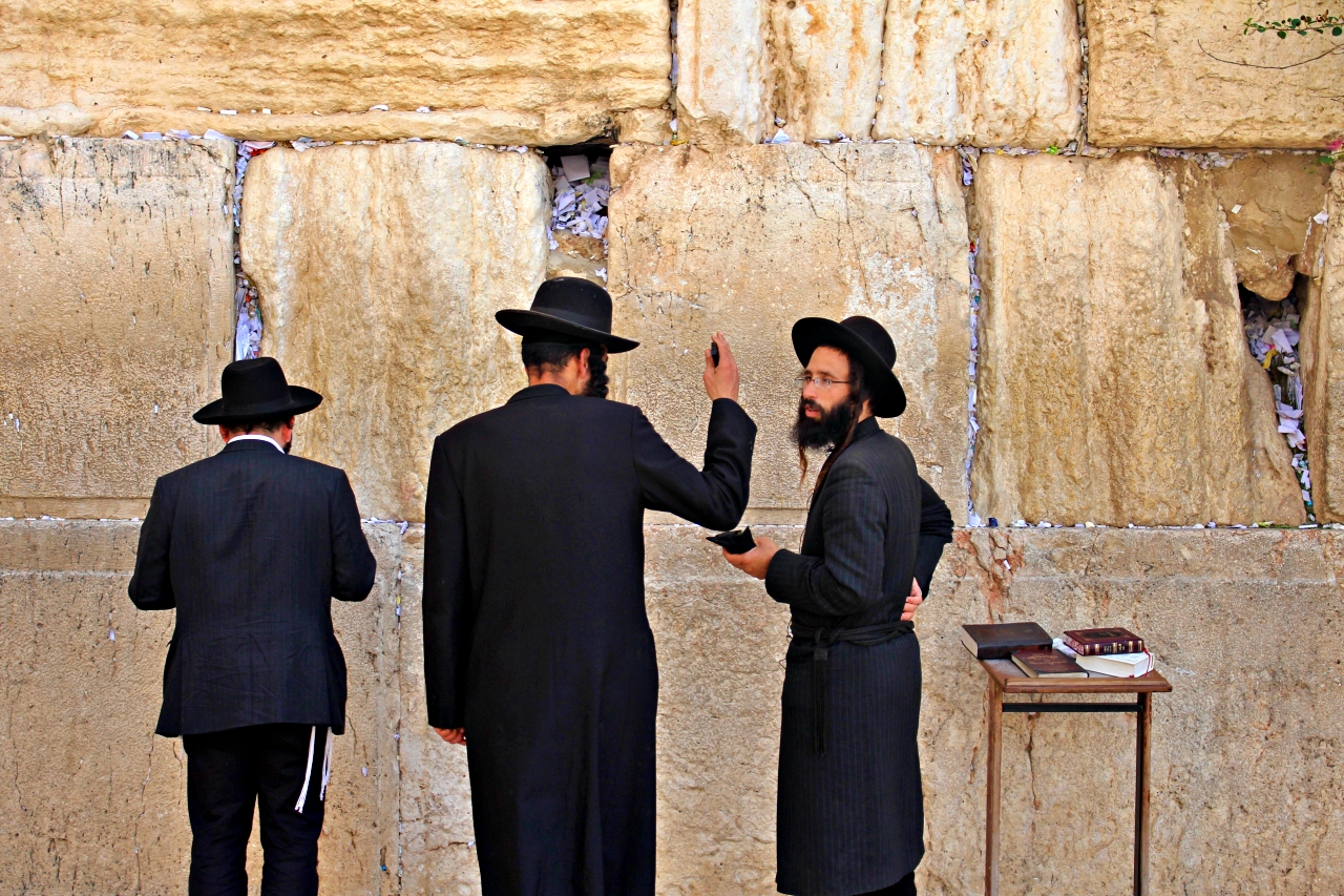 Reciting a Brief Prayer at the Wailing Wall in Jerusalem Israel