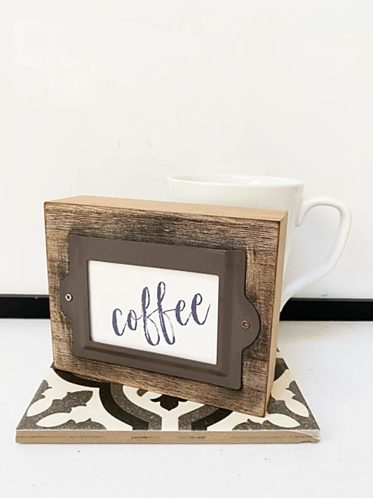 dollar store coffee sign with a tile and mug