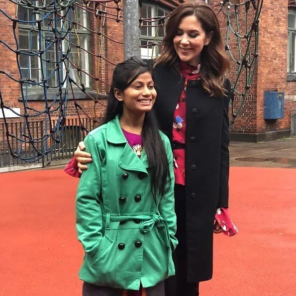 Crown Princess wore a floral print mock-neck ruffle-sleeve blouse by Erdem. 14-year-old Farzana from Dhaka