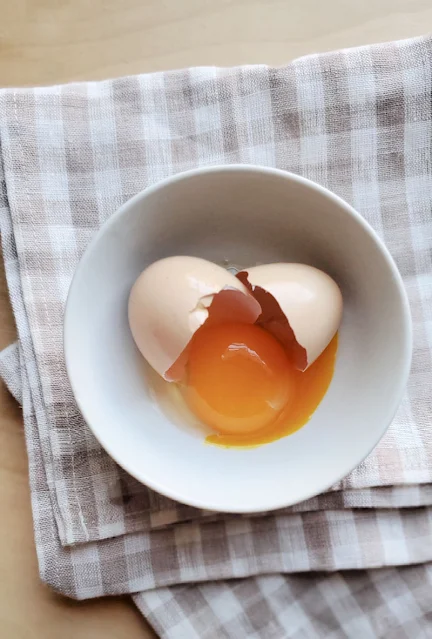 Egg cracked into a bowl