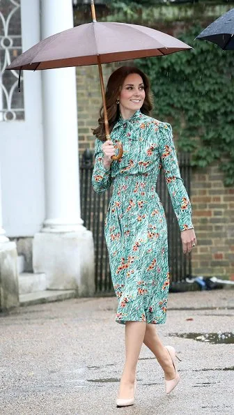 Kate Middleton wore Prada Printed silk dress, Monica Vinader Gold Vermeil Earrings and LK Bennett Fern pumps. Prince Harry