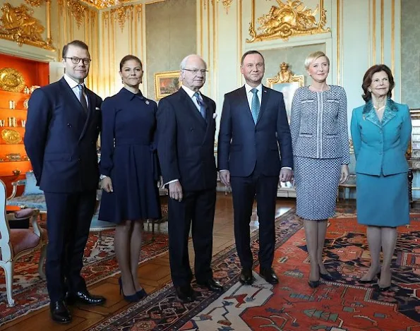 Poland's President Andrzej Duda and his wife Agata Kornhauser-Duda. Crown Princess wore Yves Saint Laurent Suede Pumps, Greta midi dress in blue, Dolce Gabbana handbags, Ebba Brahe earrings