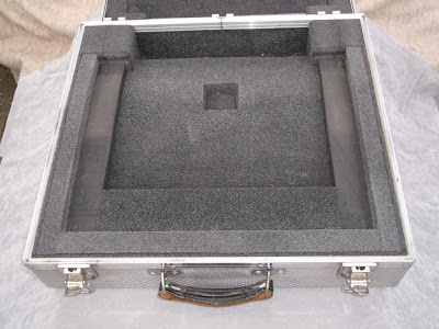 Image of a small solid aluminium flight case opened