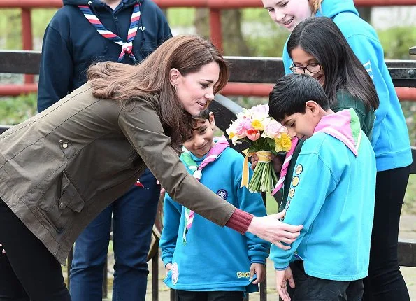 Kate Middleton is wearing her J Crew Mockneck sweater and Chloe boots