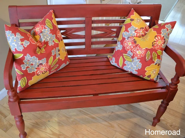 A beautiful newly painted front porch bench