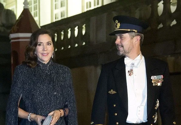 Crown Princess Mary wore Julie Fagerholt Heartmade Benina cape and Lasse Spangenberg gown, J Furmini clutch. Crown Prince Frederik