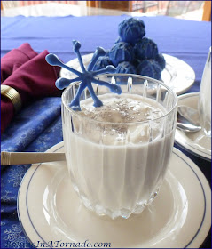 Holiday Snowflake Cocktail, a thick vanilla milkshake spiked with holiday cheer | Recipe developed by www.BakingInATornado.com | #recipe #holiday #cocktail