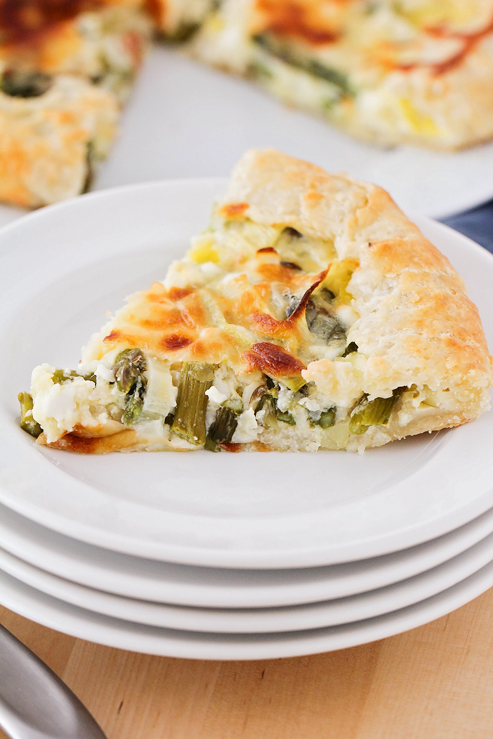 This leek and asparagus galette has a tender pastry shell filled with cheese and vegetables. So easy and so delicious!