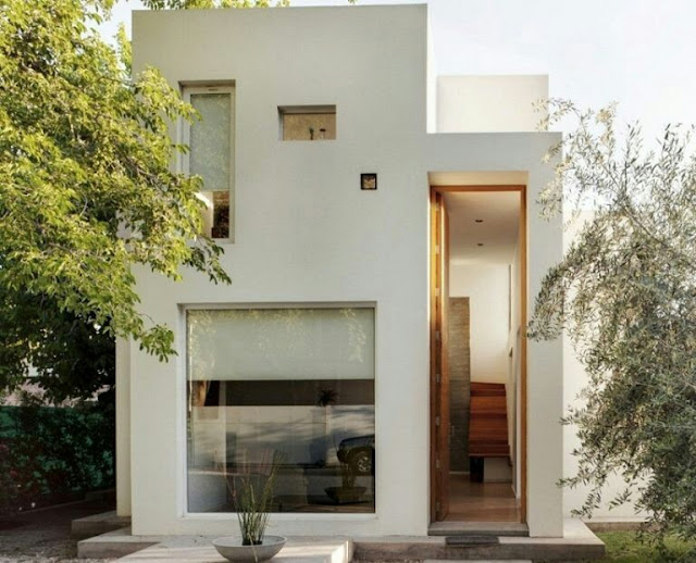Minimalist 2-storey house in the form of a flat top cube