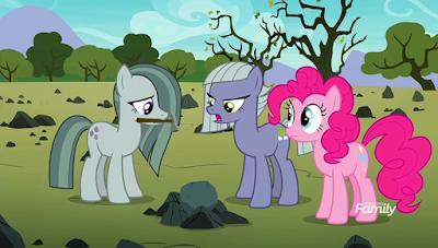 Marble holding a pick in her mouth, with an angry-looking Limestone and a calmer Pinkie alongside