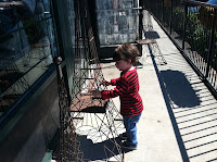 Toddler with replica of the Eiffel Tower, Amalie's French Bakery, NoDa, Charlotte, NC