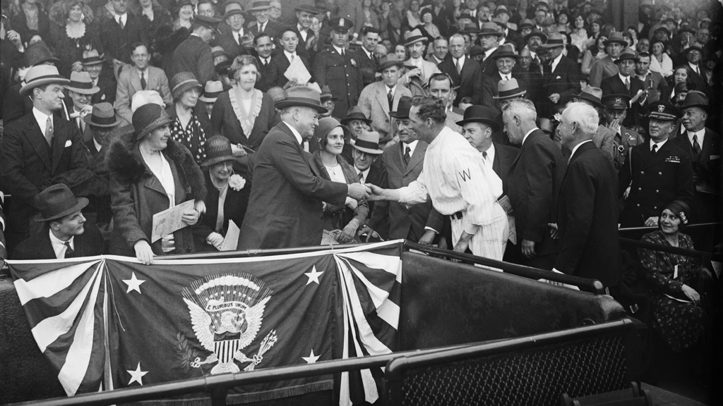 Lou Hoover and Herbert Hoover shaking hands with Walter Johnson at baseball game, 1931