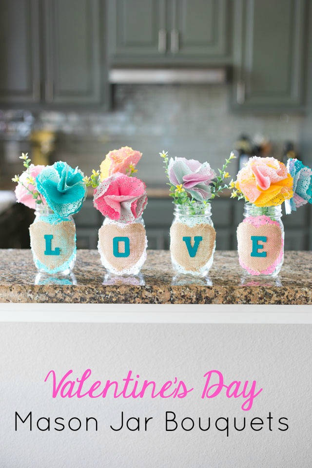 These mason jars filled with doily flowers are a pretty DIY Valentine's Day decoration or centerpiece! #valentinecrafts #valentinescrafts #masonjarcrafts #doilycrafts #doilyflowers #paperflowers #valentinesdaycrafts These mason jars filled with doily flowers are a pretty DIY Valentine's Day decoration or centerpiece! #valentinecrafts #valentinescrafts #masonjarcrafts #doilycrafts #doilyflowers #paperflowers #valentinesdaycrafts