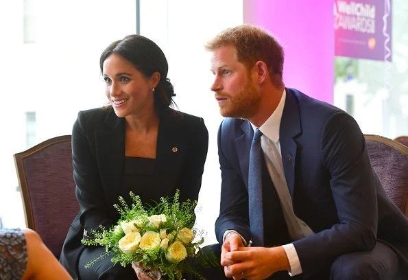 Meghan Markle wore Altuzarra Acacia blazer and wool Pants, Deitas Coco shantung camisole, Aquazzura pumps, carries Stella McCartney Bag