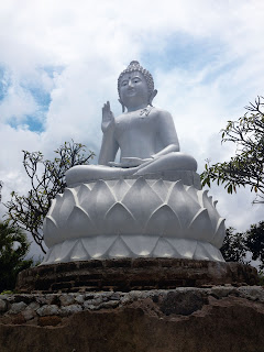 white buddha statue at the brahmavihara arama monastery