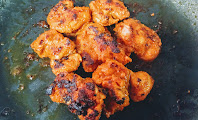 Crisp golden chicken Tikka on pan or tawa