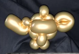 Wunderlampe aus goldefarbenen Modellierballons als Ballonmodellage.