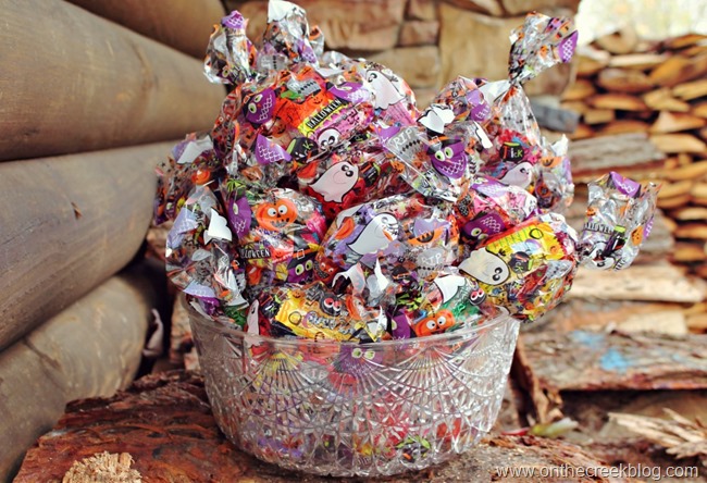 Last-minute Halloween setup featuring treat bags and a repurposed punch bowl as a candy bowl. | on the creek blog // www.onthecreekblog.com