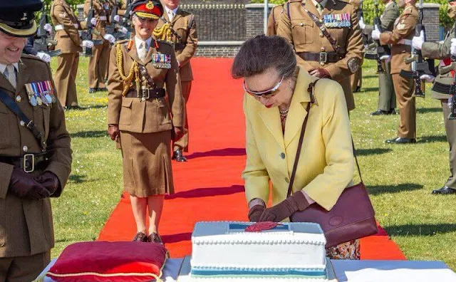 The Princess Royal wore a yellow jacket, blazer and floral print midi skirt or dress. Burgundy leather bag and sunglasses