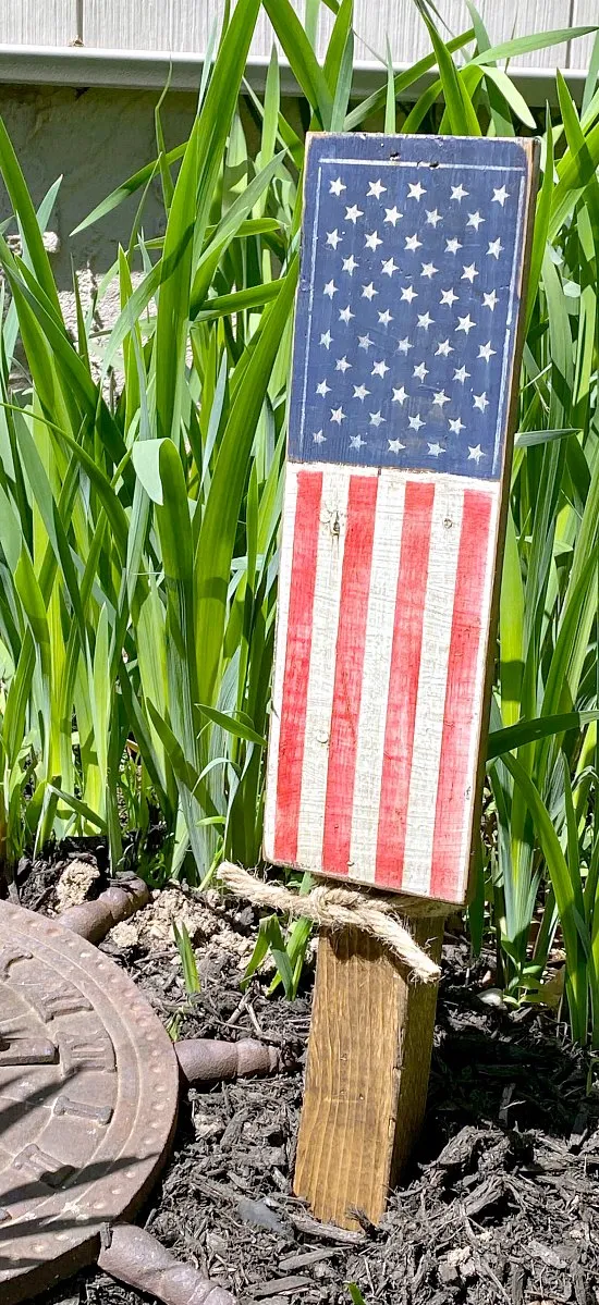 Wooden plant stake with American flag stencil