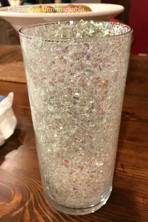 Sparkly snowy glitter glued to inside of glass vase