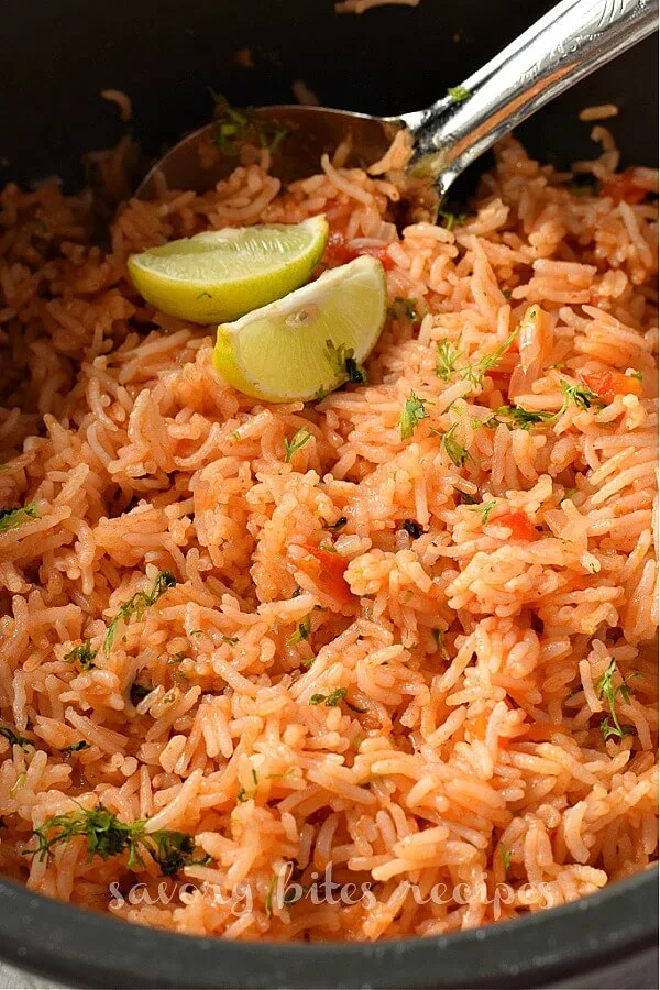 cilantro chopped on mexican rice in a pot