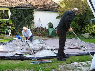 Mr A and J inserting the fibreglass poles