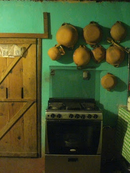 Heavy Sliding Wooden Door, Adobo Pots, One of Our Stoves