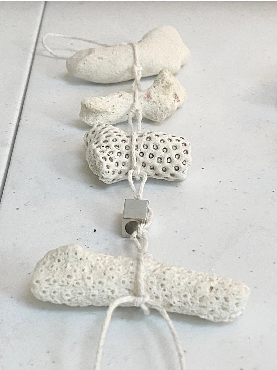 coral tied to cotton string