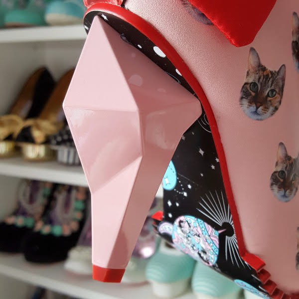 close up of pink diamond shaped heel on ankle boot