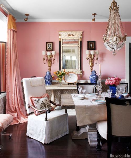 feminine and glamorous dining room with pink walls