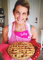 Photo of food blogger Sally holding a fruit pie