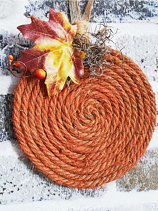 orange jute pumpkin with leaves