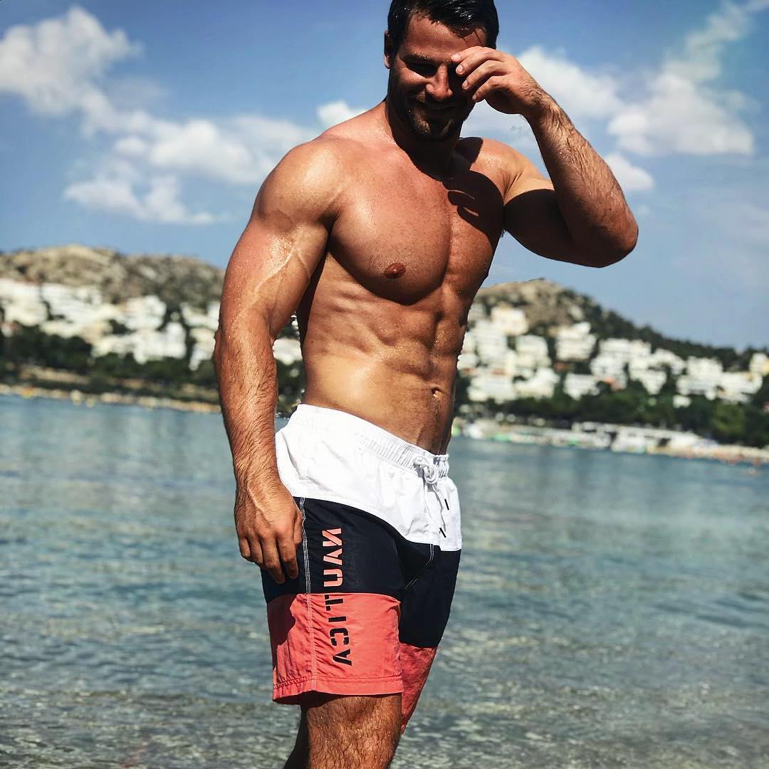 cute-beefy-shirtless-hairy-daddy-smiling-beach