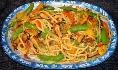 LO MEIN NOODLE WITH SUGAR SNAP PEAS AND SHIITAKE MUSHROOMS PORTIONS: 3 INGREDIENTS ½ lb. lo mein noodles SAUCE 1 cube fermented chili bean curd ½ cup chicken broth 1½ tbsp. soy sauce 1 tsp. cornstarch STIR FRY VEGETABLES 1 tbsp. vegetable oil 1 tbsp. sesame oil 1 shallot, diced 1 minced garlic clove 2 tsp. minced ginger 1½ cups sugar snap peas 1 cup sliced shiitake mushrooms ¼ red pepper cut in Julianne ¼ orange pepper cut in Julianne ¼ yellow pepper diced METHOD Cook lo mein noodles in boiling water for about 5 minutes. Strain noodles and cool off with cold running water. Set aside. SAUCE In a bowl dissolve fermented chili bean curd in chicken broth. Stir in soy sauce and cornstarch. STIR FRY VEGETABLES Heat up a wok or frying pan with vegetable oil, sesame oil and stir fry shallot, garlic and ginger together. Add and stir fry shiitake mushrooms for 2 minutes. Add and stir fry the rest of the vegetables until sugar snap peas have a bright green color. Pour in the sauce, the noodles and mix well. Heat up the noodles for a minute. Serve immediately.