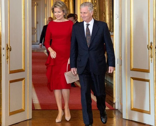 Queen Mathilde wore H&M Red Long Sleeve Ruffle Midi Dress. royal reception at the Royal Palace in Brussels. Edouard Vermeulen