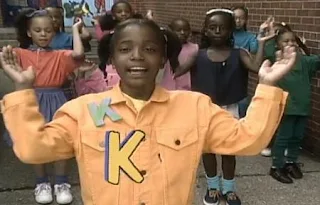 Little girls sing a song about the letter K, clapping and dancing. Sesame Street All Star Alphabet