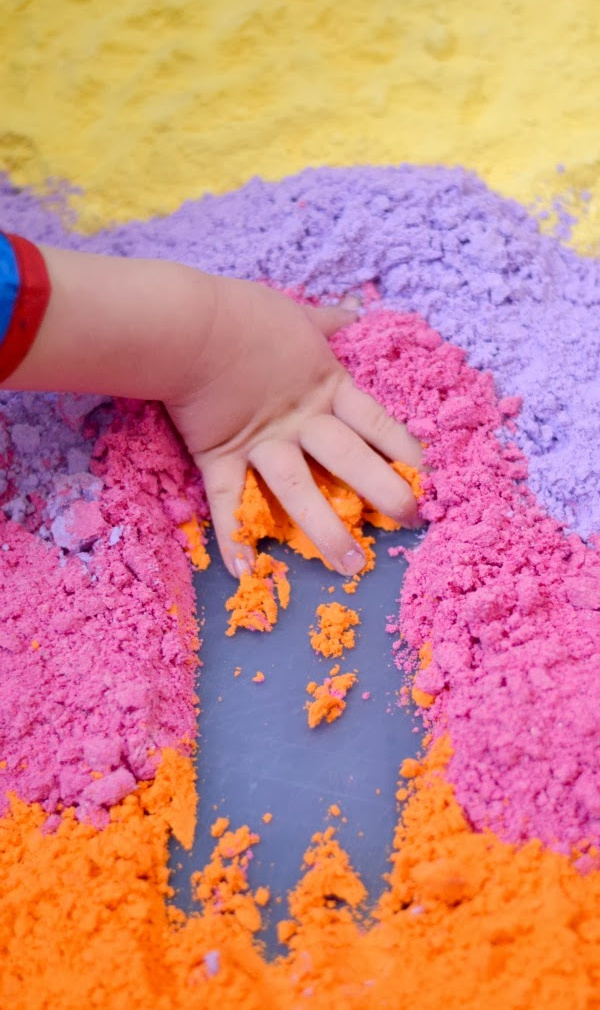Make cloud dough in every color of the rainbow with this easy recipe for kids! #clouddough #clouddoughrecipe #coloredclouddough #rainbowclouddough #growingajeweledrose #activitiesforkids