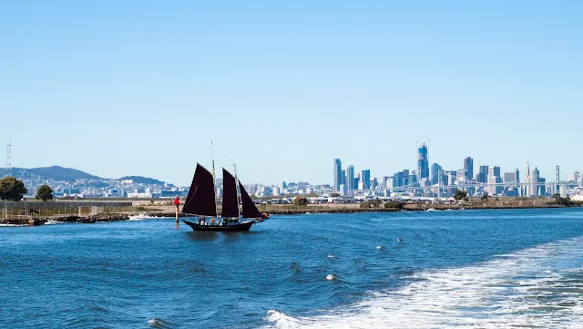 3-masted sailboat and San Francisco Skyline viewed from the San Francisco Bay Ferry
