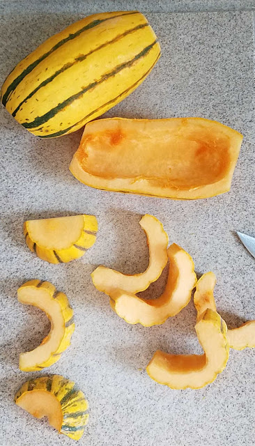 cleaning and cutting delicata squash delicata squash cut in half and then into crescent shaped slices