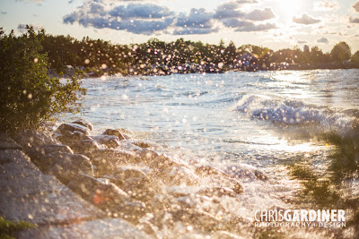 water droplets from the windy sunset on georgian bay thrown into the air near and far making some blurry and some sharp
