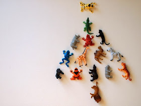 plastic animals arranged like a christmas tree
