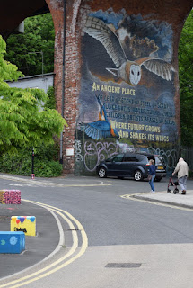 A huge colourful mural on Byker Bridge arch