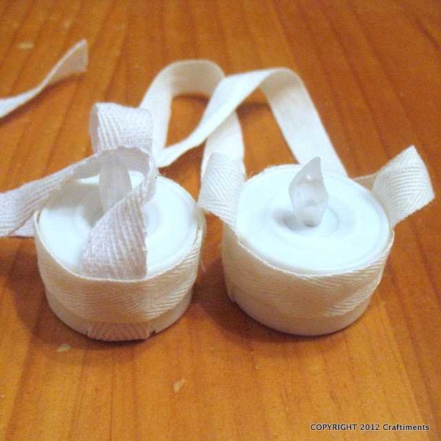 Craftiments.com:  Tea lights glued to twill tape