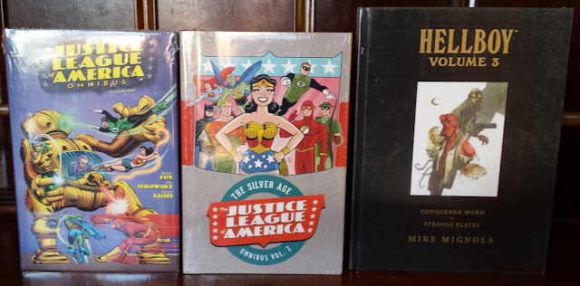 Picture showing the front covers of the JLA omnibus and Hellboy editions