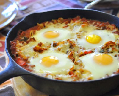 Refried Bean Sauce with Eggs on Top ♥ KitchenParade.com, a hearty protein-packed weekend brunch recipe.